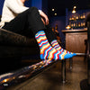 Banger chevron crew socks for men styled with black formal trousers — vibrant designer pattern — Dynamocks