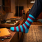 Bold Stripes Aqua Wine crew socks styled in a mid-century vinyl listening room — premium cotton socks — Dynamocks