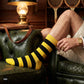 Yellow and black striped crew socks in a vintage club setting — Dynamocks India