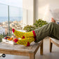 Chillies crew socks styled with olive trousers on a sunlit balcony over breakfast – Dynamocks