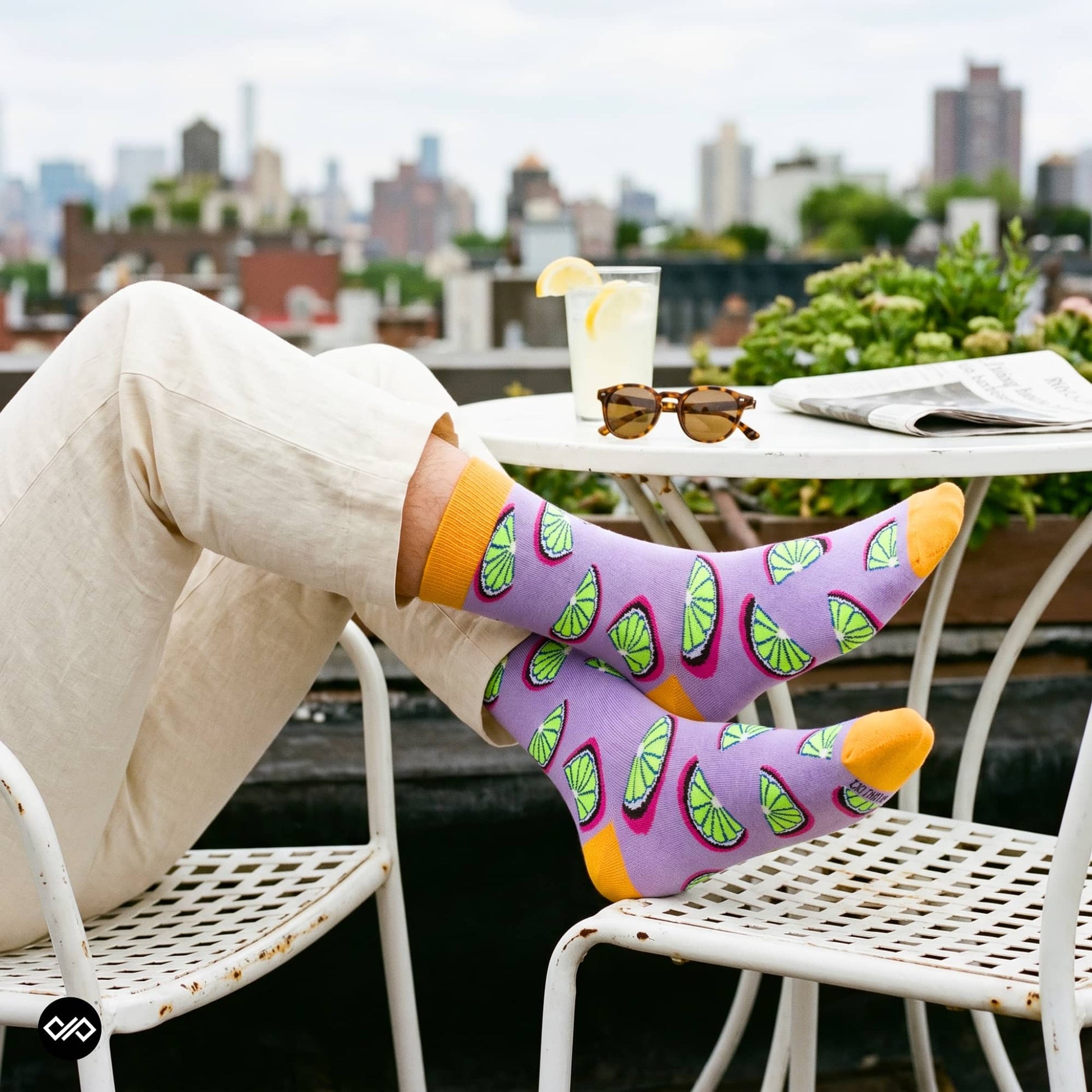 Citrus crew socks styled with rolled-up linen trousers at rooftop café — citrus fruit design cotton socks – Dynamocks India