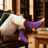 Classic crew socks paired with cream chinos in wood-panelled library – Dynamocks