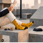 Cutting Chai Indian crew socks for men styled with rooftop chai and newspaper — marigold yellow design — Dynamocks