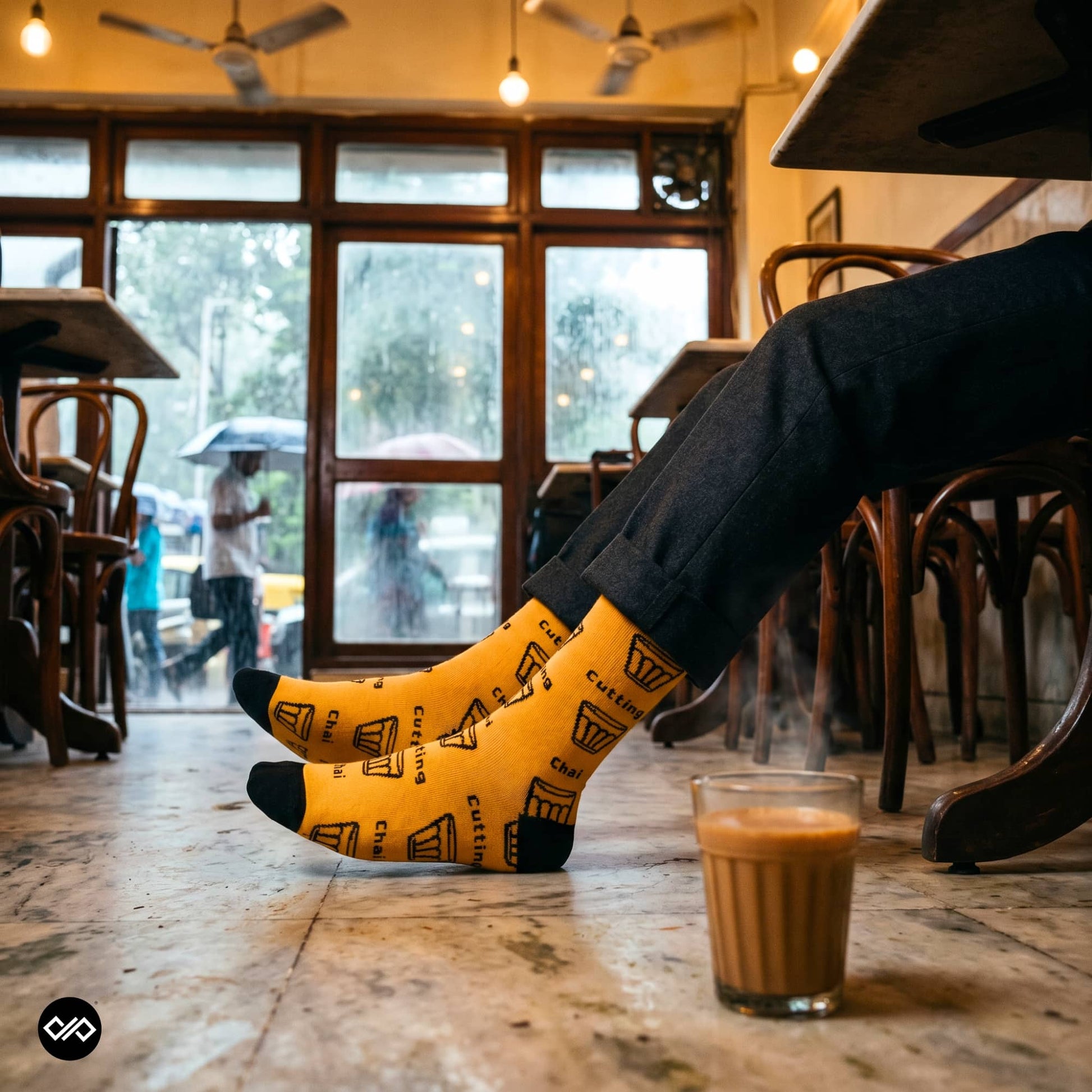 Cutting Chai crew socks styled at Mumbai Iranian café with chai glass — funky Indian designer socks — Dynamocks