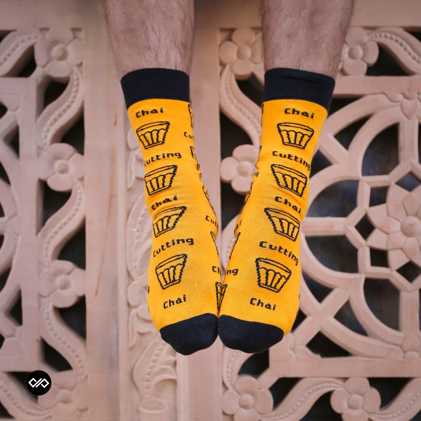 Cutting Chai Indian crew socks for men and women — marigold yellow with Mumbai chai glass design — Dynamocks