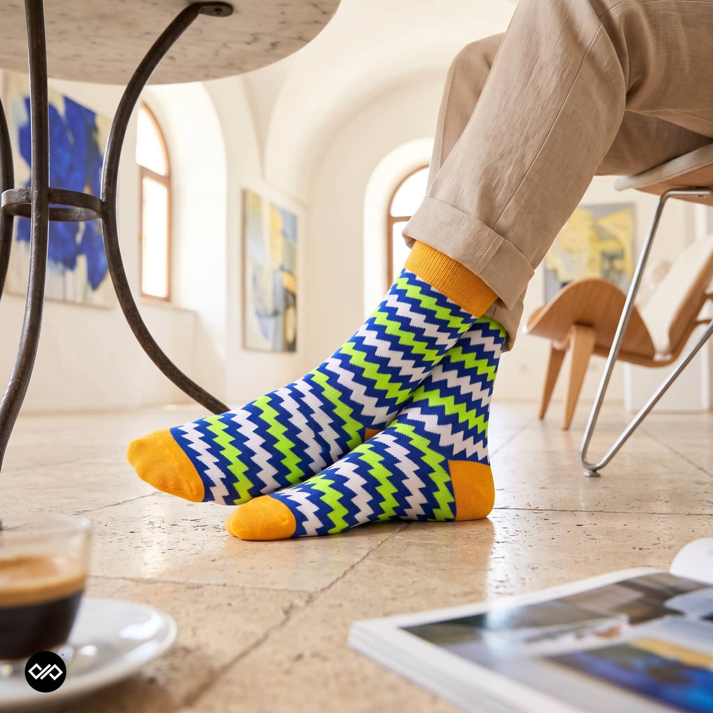 Electro funky crew socks for men styled with beige linen trousers in art gallery — neon zigzag — Dynamocks