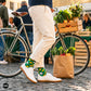 Fresh botanical leaf crew socks styled with cream chinos and white sneakers at a farmers market with bicycle and fresh produce — Dynamocks India