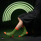 Illusion neon striped crew socks styled with black tailored shorts under a green neon arc — Dynamocks India