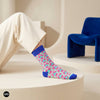 Jazz funky abstract crew socks for men styled in a minimal studio with cobalt blue accent chair — Dynamocks