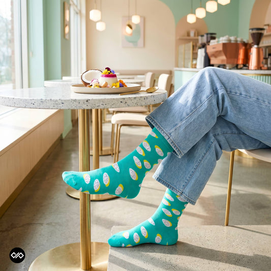 Polka dragon fruit crew socks worn with rolled denim at a pastel café with dragon fruit dessert — Dynamocks India