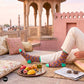 Rangoli Indian ethnic crew socks at Rajasthani palace rooftop — maroon, mustard & mint diamond pattern — Dynamocks