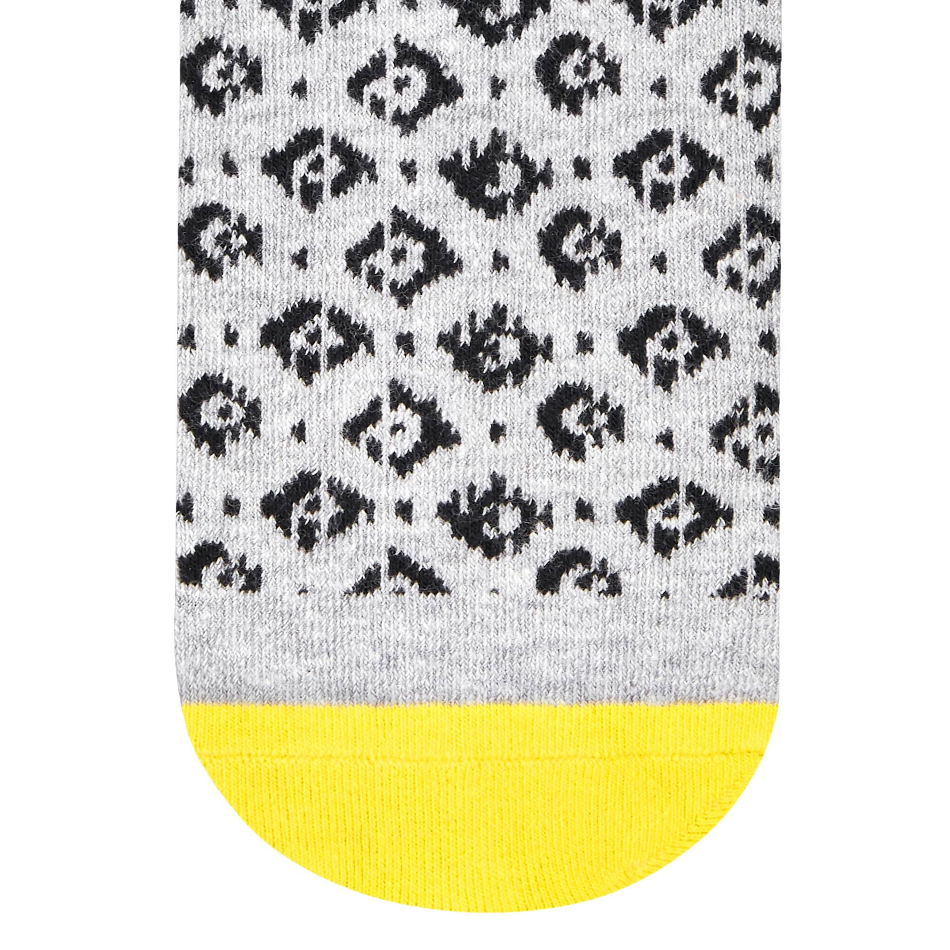 Rogue crew socks pattern close-up showing black folk motif on heathered grey base with yellow toe — Dynamocks
