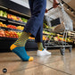 Teal blue and mango striped crew socks for women with navy trousers and white sneakers grocery shopping — Dynamocks designer socks
