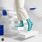Sublime turquoise striped crew socks for men styled on white stairs — Dynamocks India