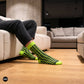 Swank neon green crew socks for men styled in modern apartment — funky designer cotton socks — Dynamocks