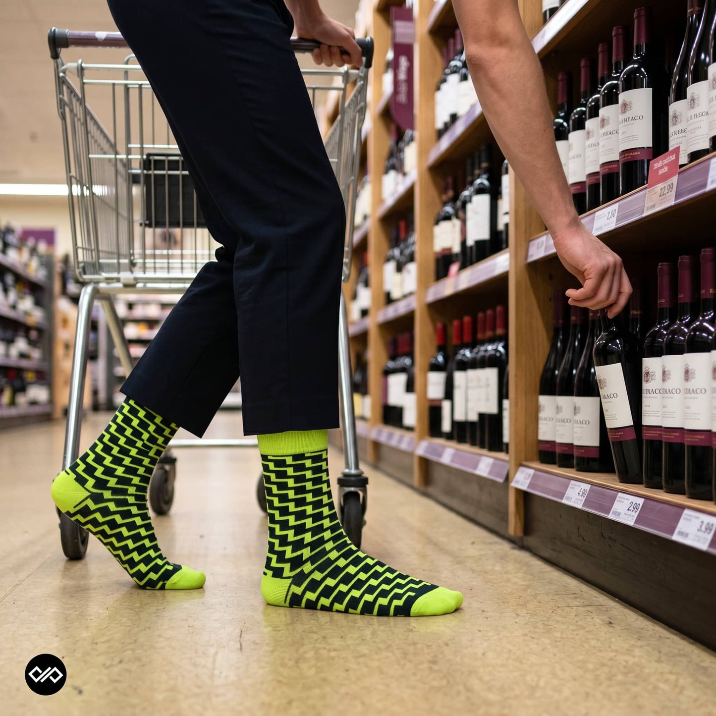Swank funky neon crew socks for men styled with black formal trousers at wine shop — Dynamocks India